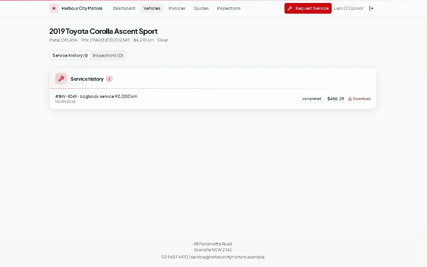 A vehicle in the customer portal showing plate, VIN, odometer in km, and its service history with invoice download.