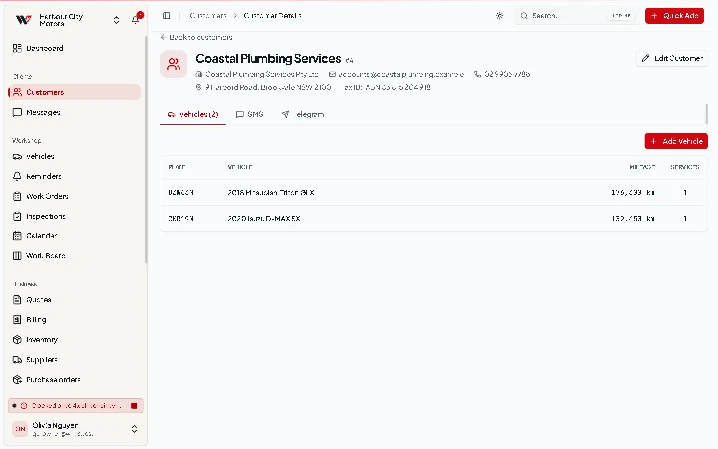 Customer page for Coastal Plumbing Services with contact details, ABN and the Vehicles tab listing two utes with plates and odometer readings.